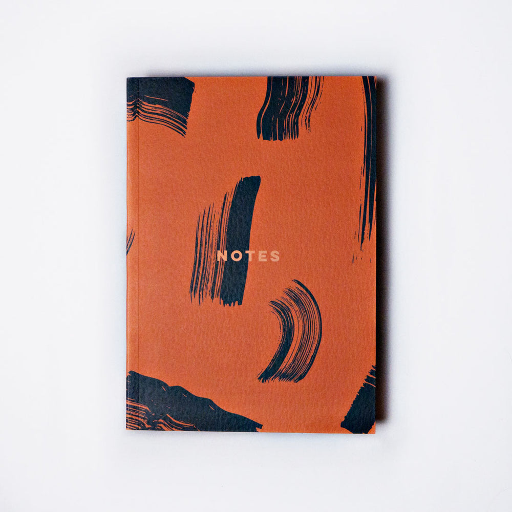 The Completist burnt orange shadow brush notebook