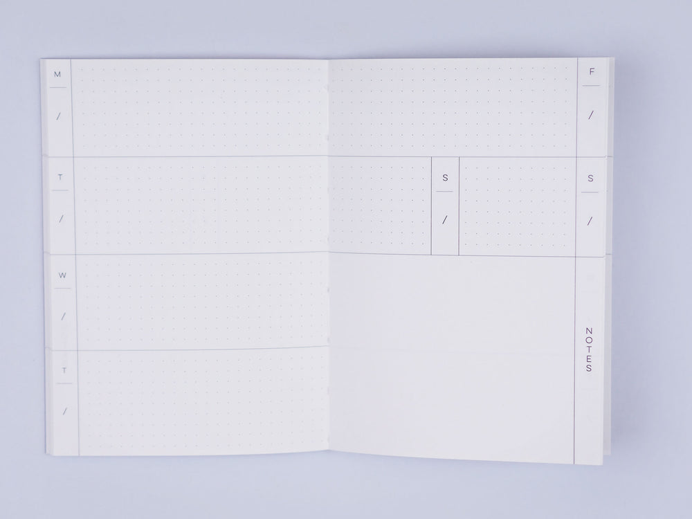 The Completist blue brush check weekly planner book